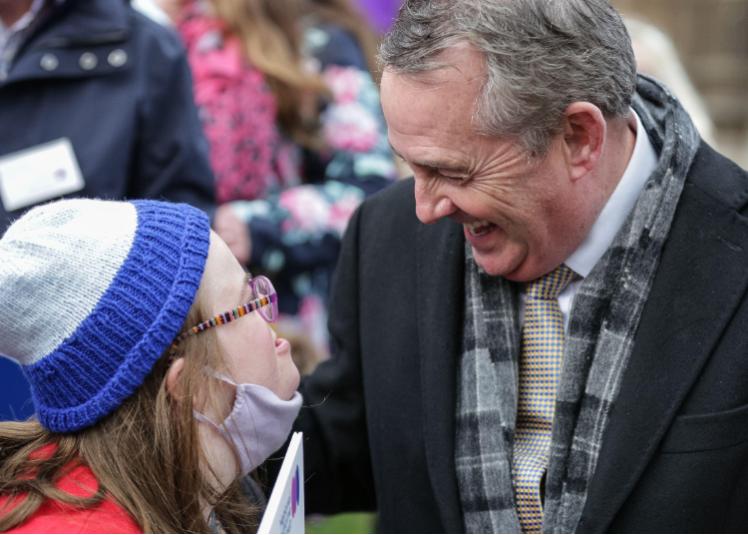 Liam Fox celebrates with National Down Syndrome Policy Group activists (Credit: Imageplotter / Alamy Stock Photo)