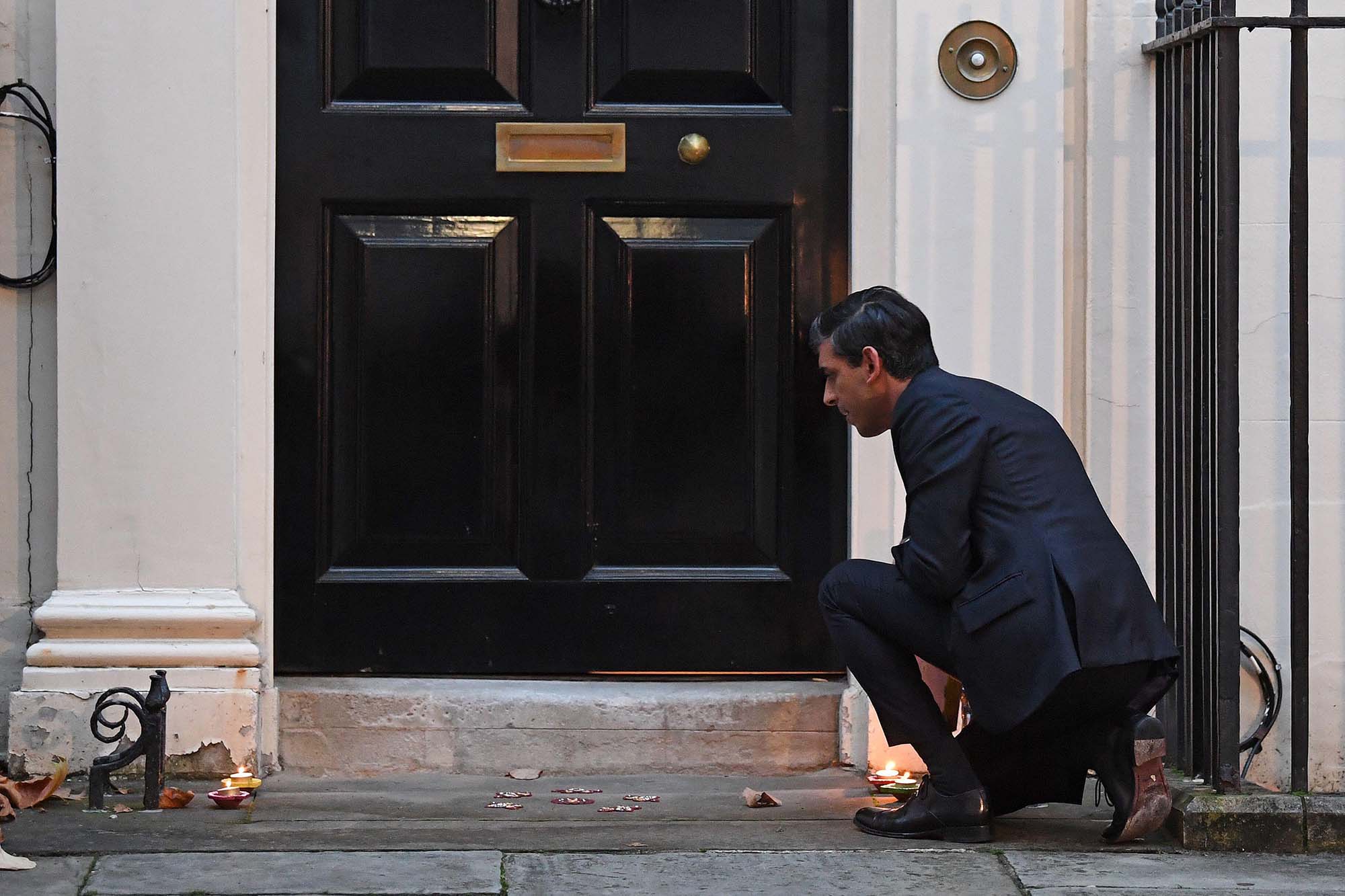 Rishi Sunak lighting a candle for Diwali outside Number 11 Downing Street as Chancellor in 202