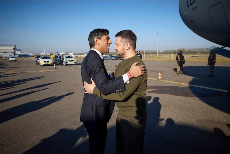Rishi Sunak and Volodymyr Zelensky hugging at Stansted airport