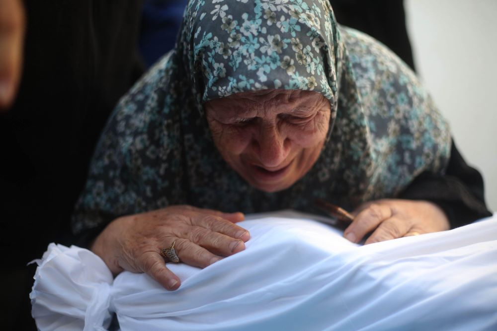 A woman mourns for her relative at a hospital in the southern Gaza Strip, Oct. 21, 2023