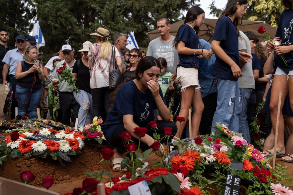 Mourners attend the funeral of Dana Bachar and her son Carmel , at Gan Shlomo cemetery, central Israel, Tuesday, Oct. 24, 2023