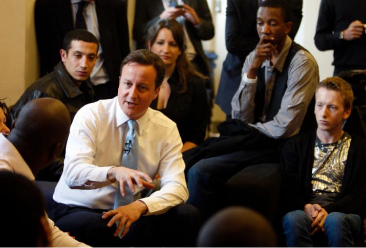 David Cameron talks to young people at SPEAR, a centre that runs free interactive six week courses for 16-24 year olds (Credit: Associated Press / Alamy Stock Photo)