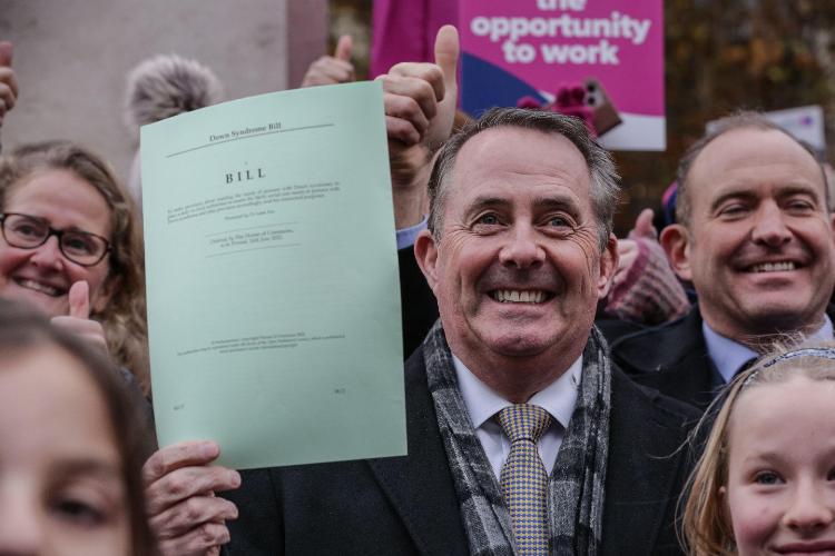 Liam Fox holds bill (Credit: Imageplotter / Alamy Stock Photo)