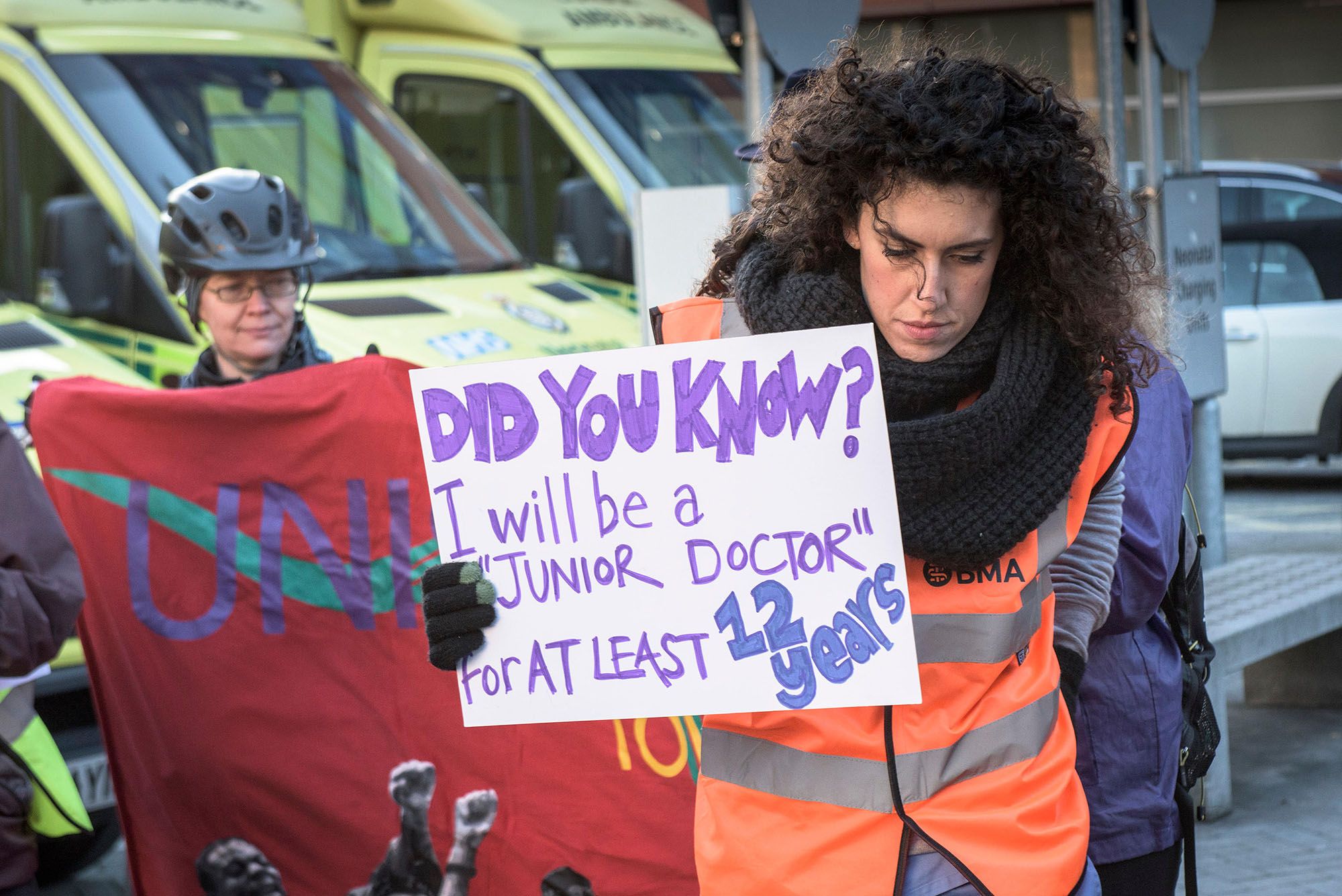 JUNIOR doctor holding a strike banner