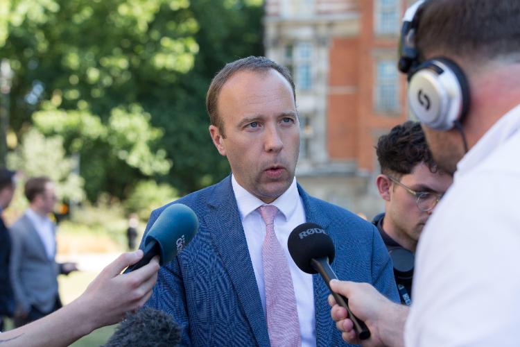 Matt Hancock speaking to journalists