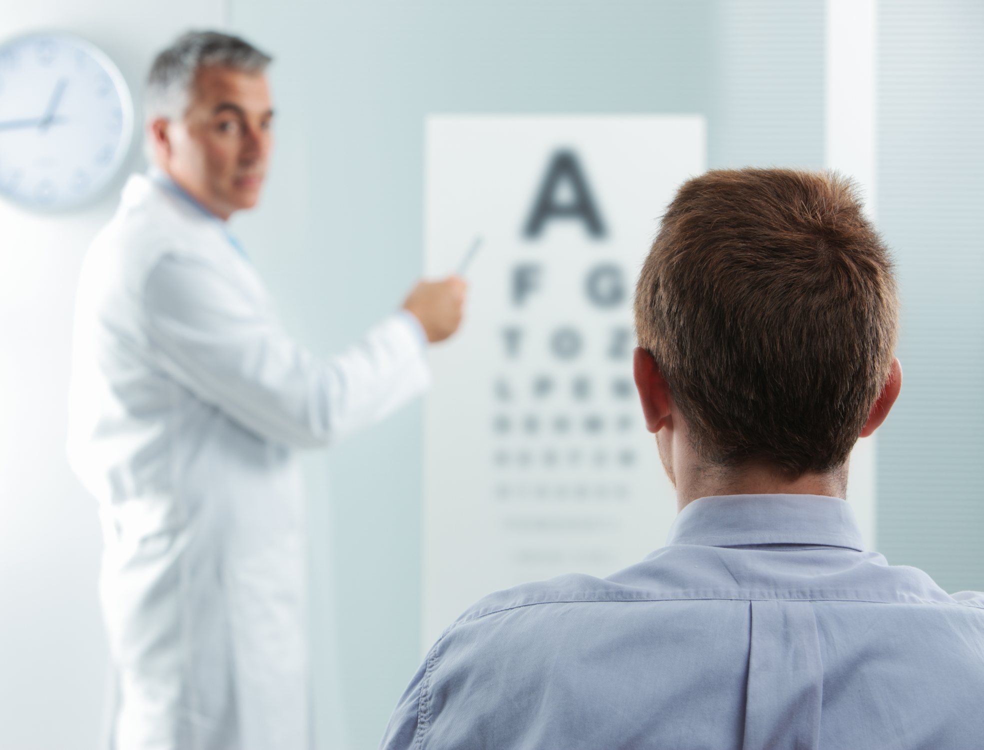Image of a man doing a traditional eye test 