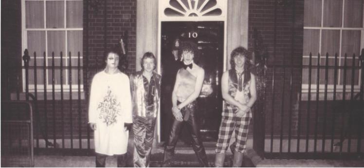 Paul Kohler (middle) standing in front of a half-obscured police officer who vainly pleaded with the group to move along