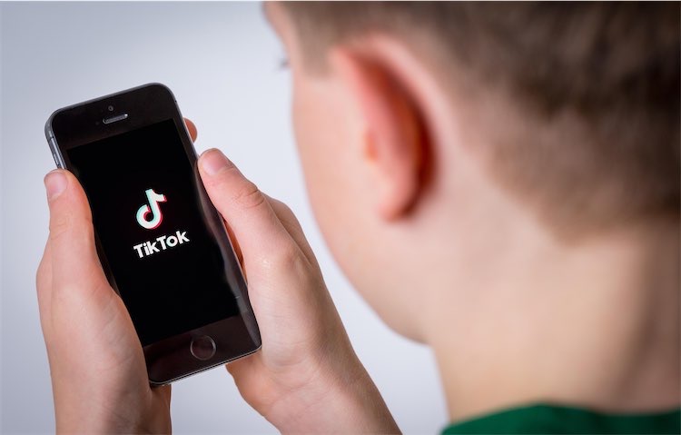Teenager on TikTok on his phone