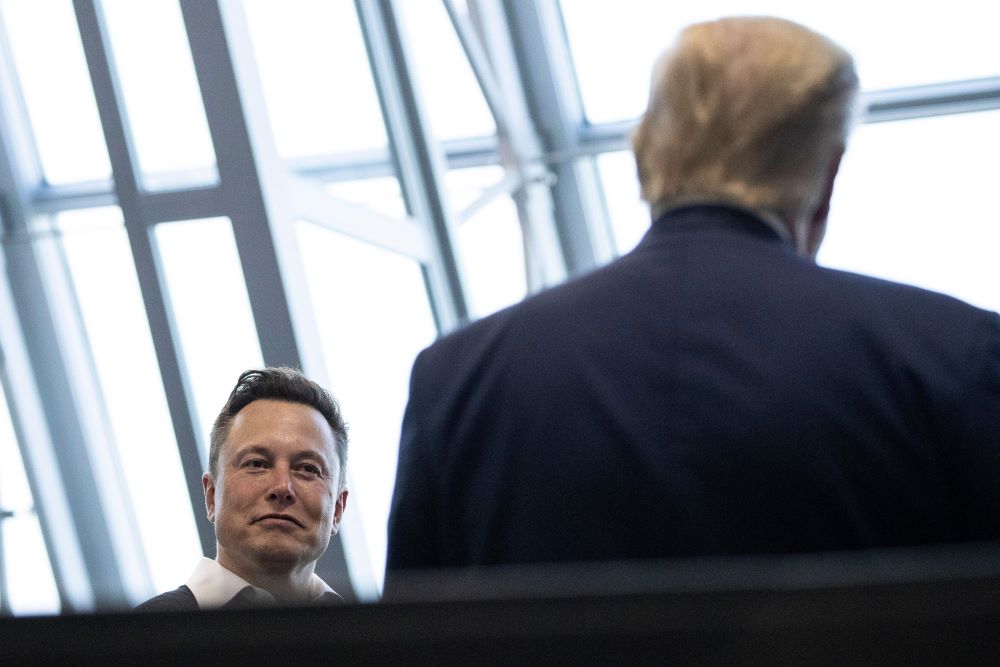 esla and SpaceX Chief Executive Officer Elon Musk talks with President Donald Trump