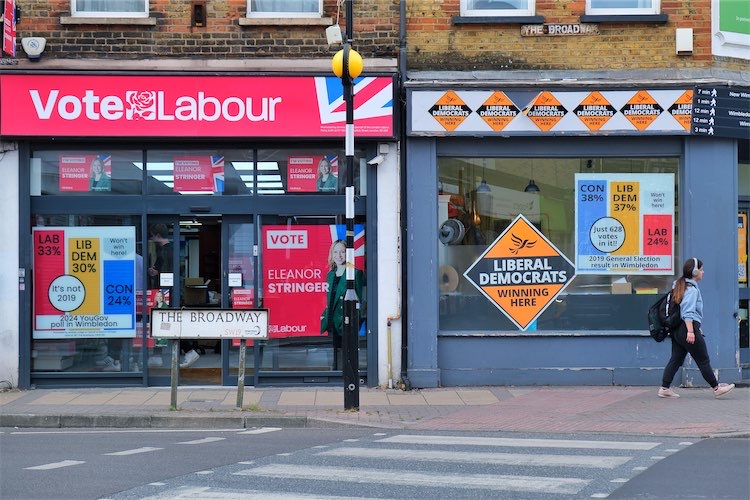 Wimbledon Labour and Lib Dem offices with bar charts claiming they would win