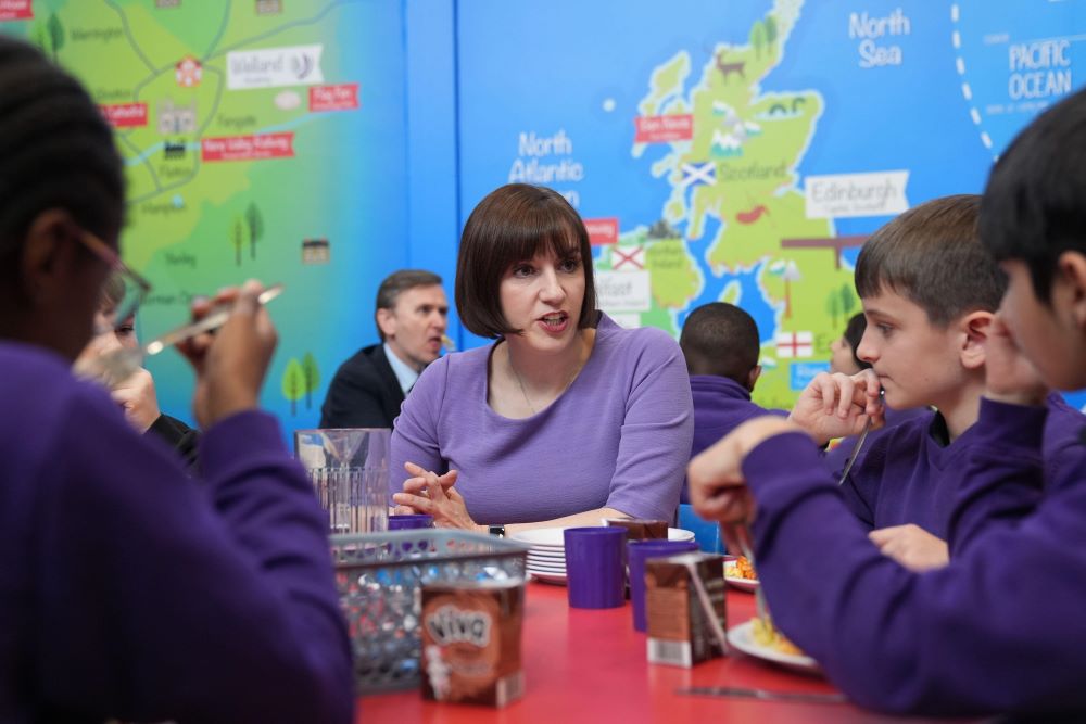 Bridget Phillipson sitting at table with pupils