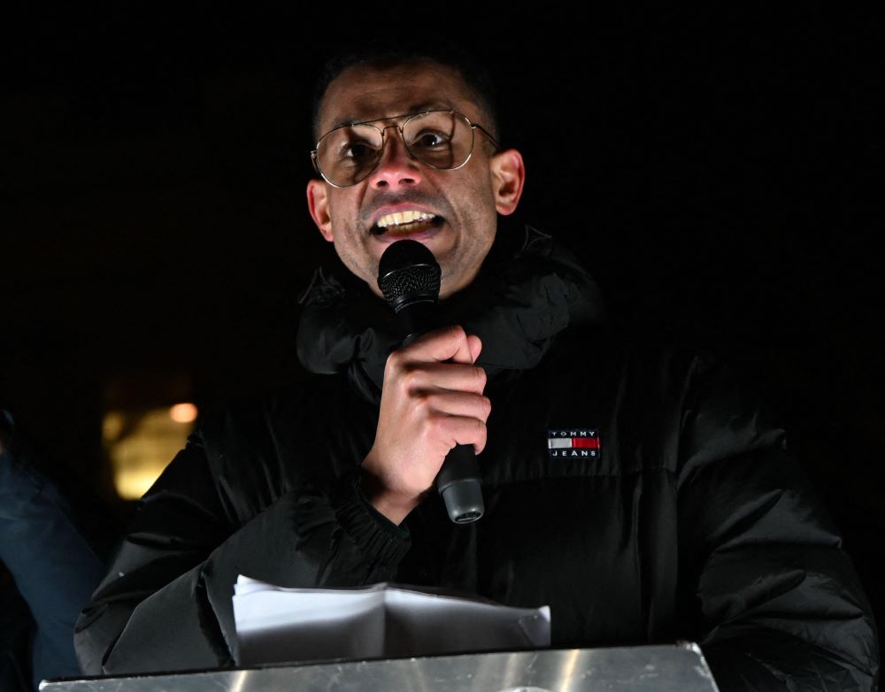 Kebede speaking at rally