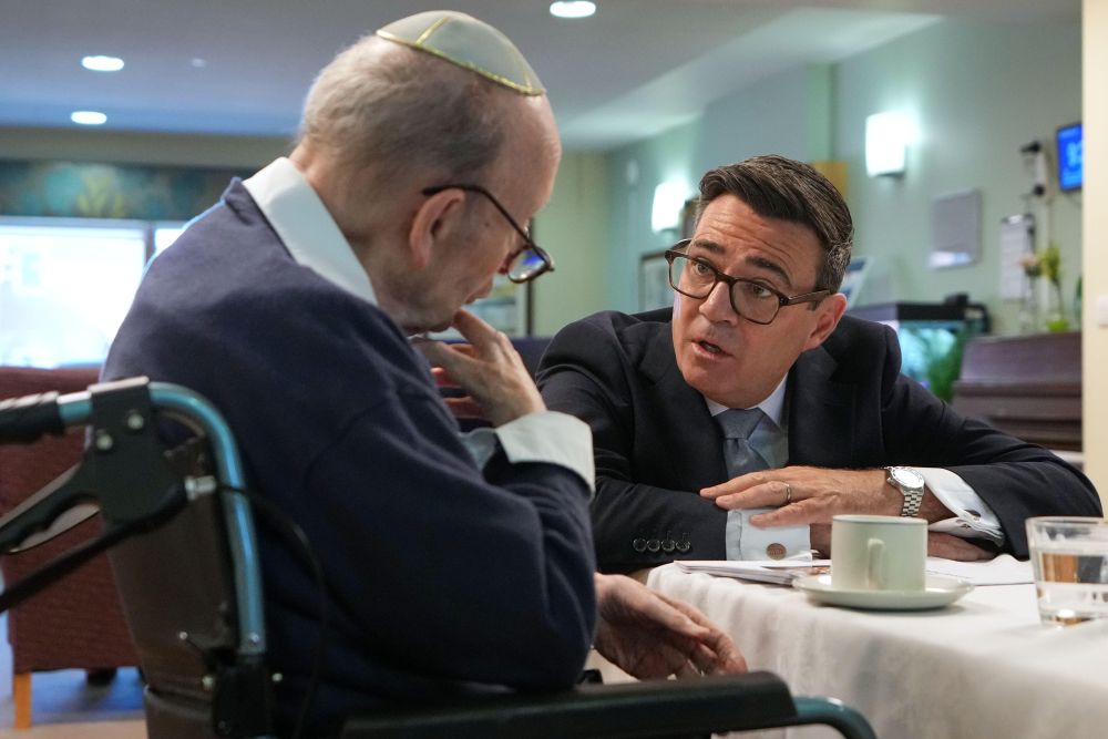 Burnham speaks with care home resident