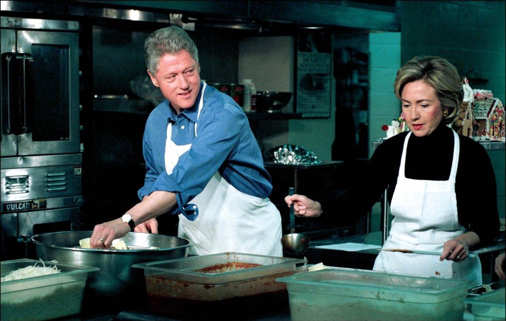 Clintons prepare lasagna at the DC Central Kitchen in Washington in 1998 